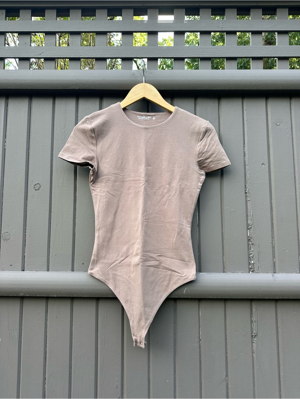 Short-Sleeve One-Piece Bodysuit in Taupe